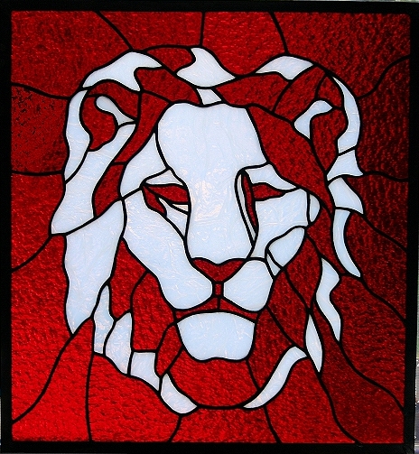 Lion head stained glass panel