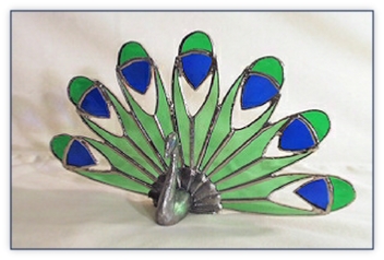 peacock figure with stained glass tail
